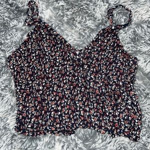 Cute floral tank top, crossover in front. And scrunchy material in the back.